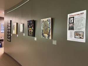 Installation of the library hallway including several two-dimensional works by LWTech employees