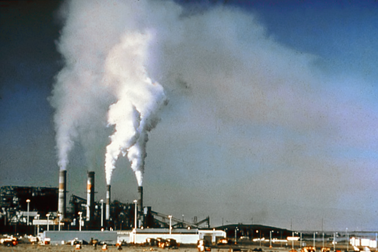 Smoke stacks spewing pollution into the sky