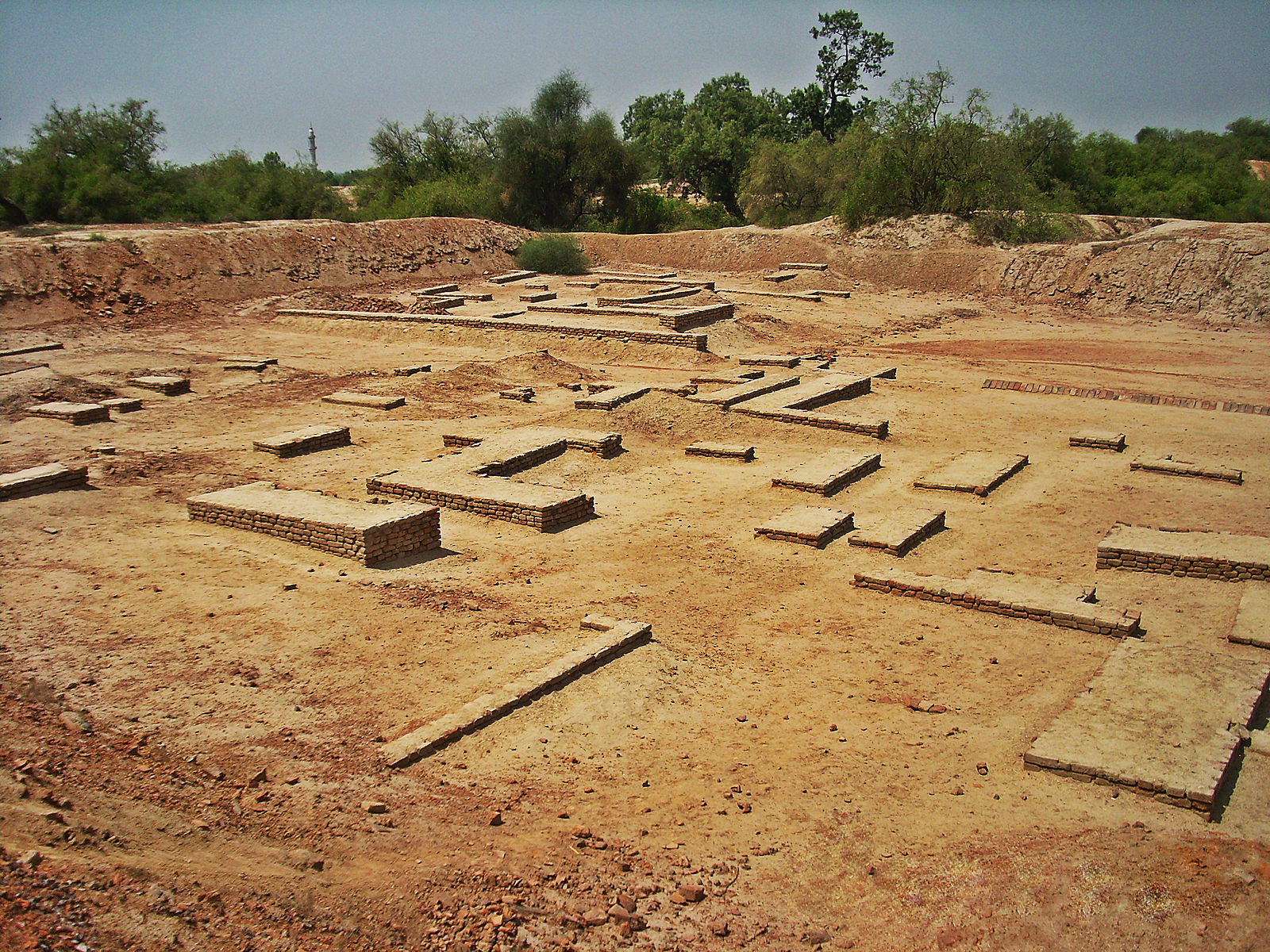 Ruins of city walls in dusty setting