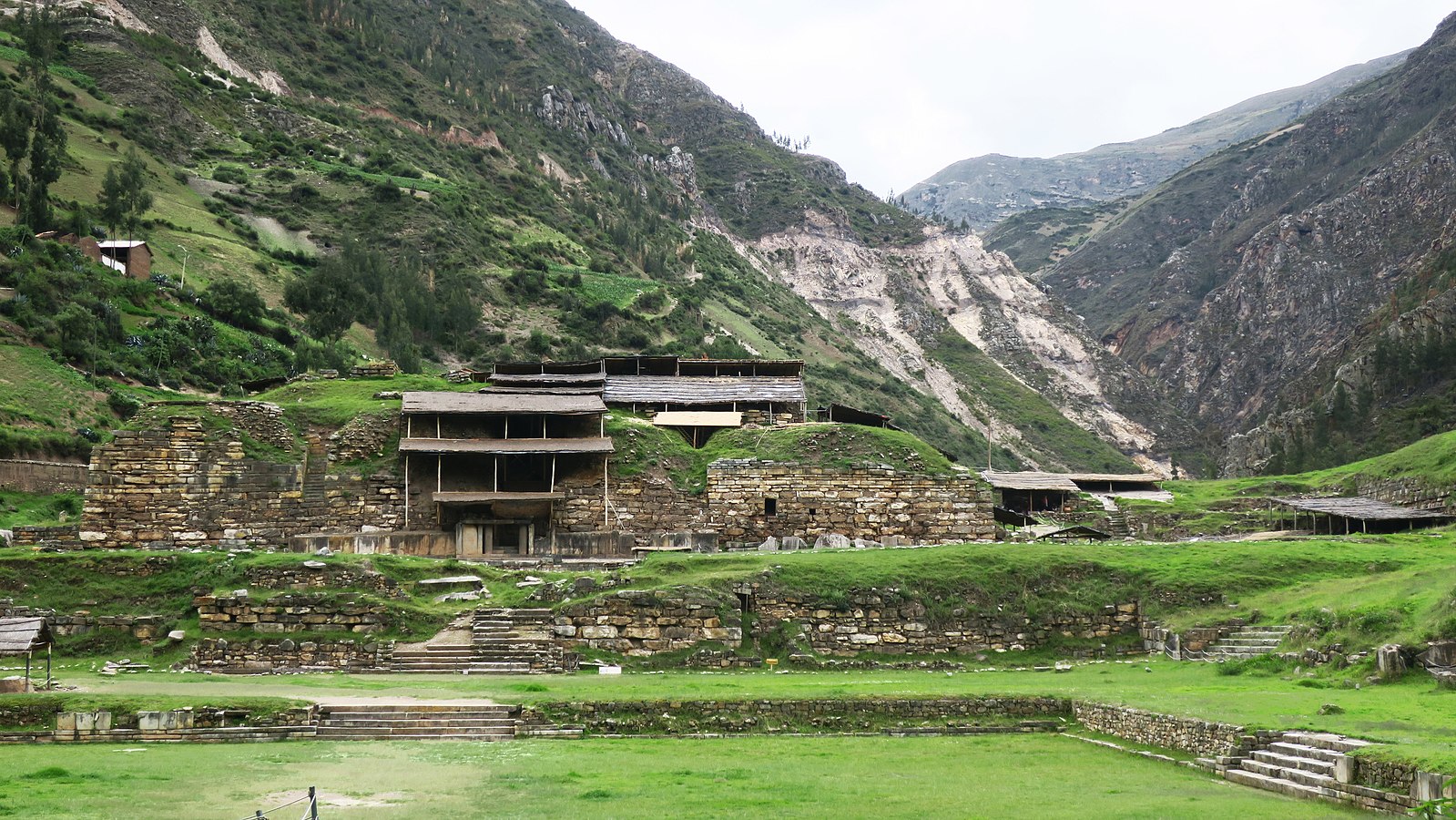 Ruins of building with mountain range behind