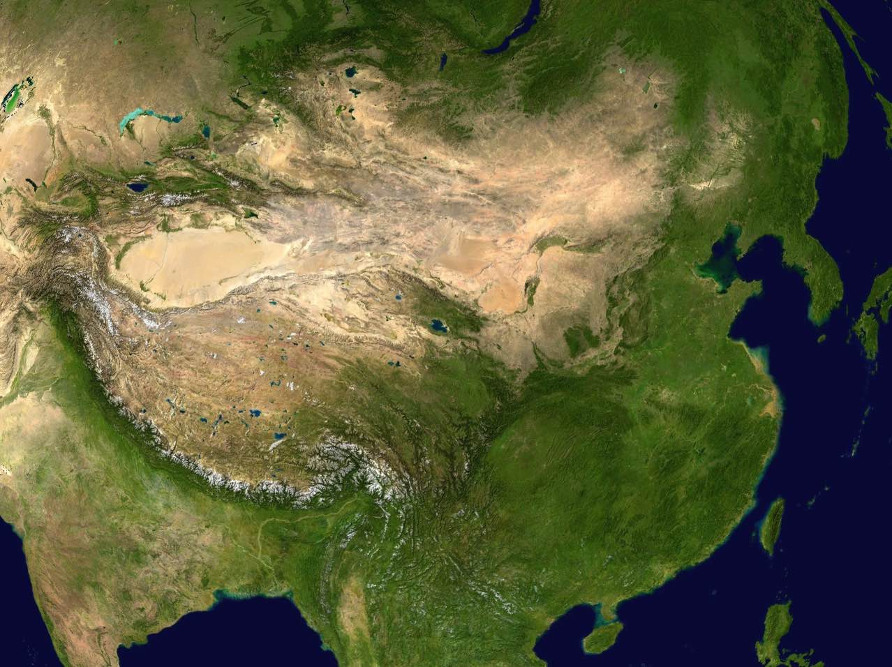 Aerial satellite image of China with deserts and mountains visible