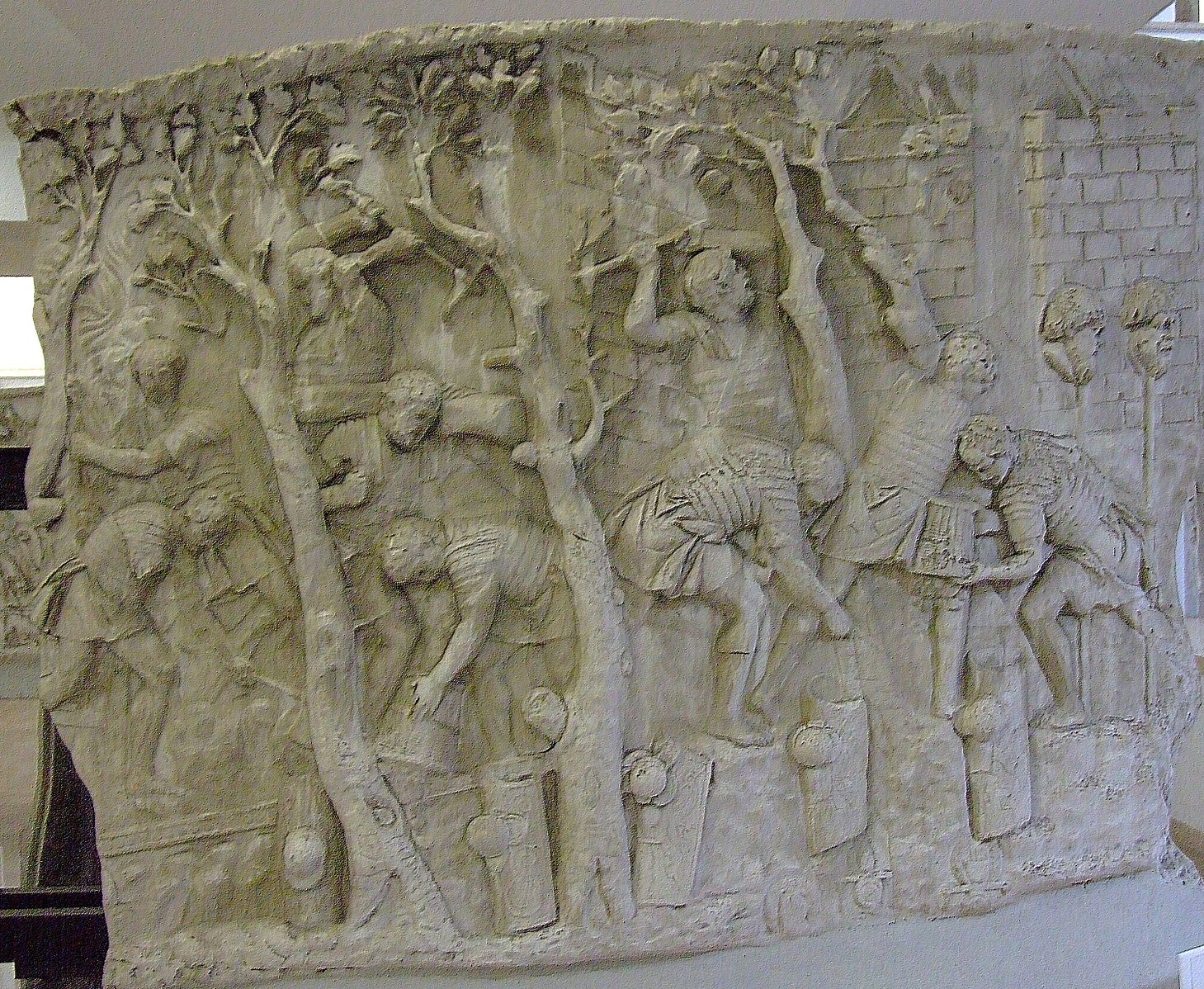 Piece of marble frieze showing men working to construct a road