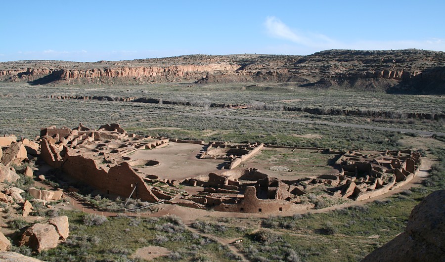 View of large canyon, with ruins of walls and buildings in the forefront