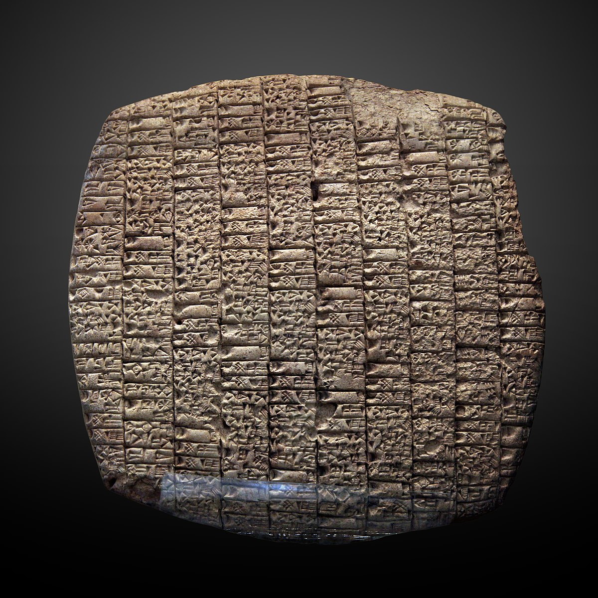 Large clay tablet filled with carved inscriptions and some figures