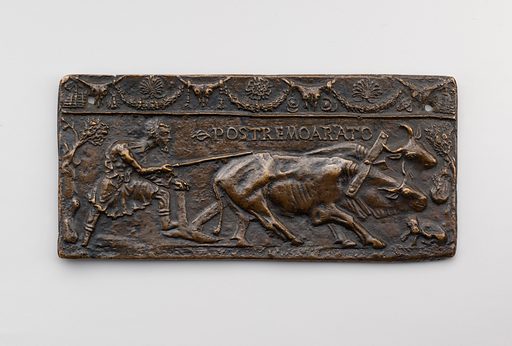 Raised metal art showing man with plow pulled by two oxen