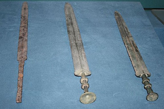 Swords of the Warring States Period (481-221 BCE) in China. The left sword is of iron while the other two are of bronze. (Shaanxi Provincial Museum, Xian, China)