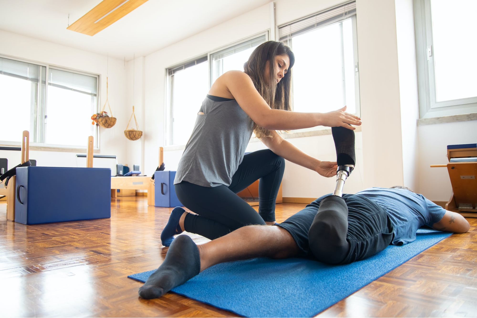 Healthcare professional stretching a patient’s leg