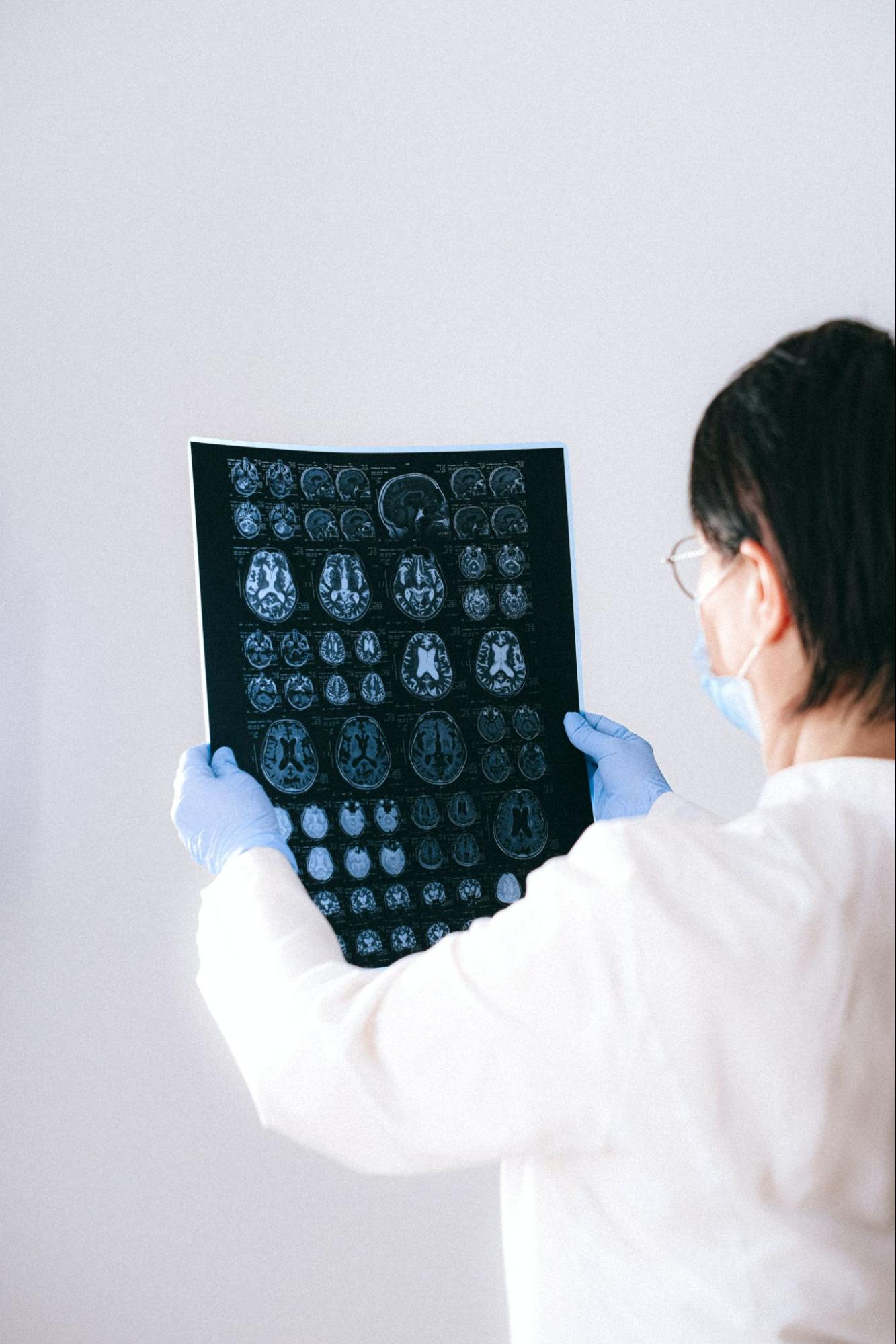 Medical provider looking at images from an MRI