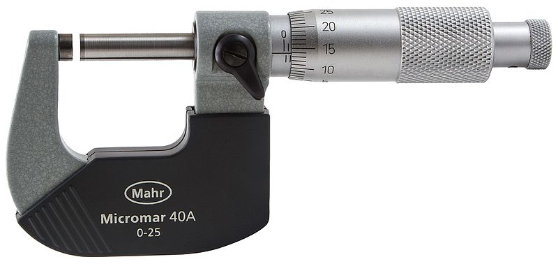 A picture of a micrometer, a measurement tool that looks like a small c-clamp with a rotating dial where the screw handle is. The micrometer is slightly open, leaving a space between the moving bar and the small cylinder (anvil) at the end of the tool. The dial shows a metric scale and the label on the side of the tool indicates that it will measure objects from 0 to 25 millimeters.