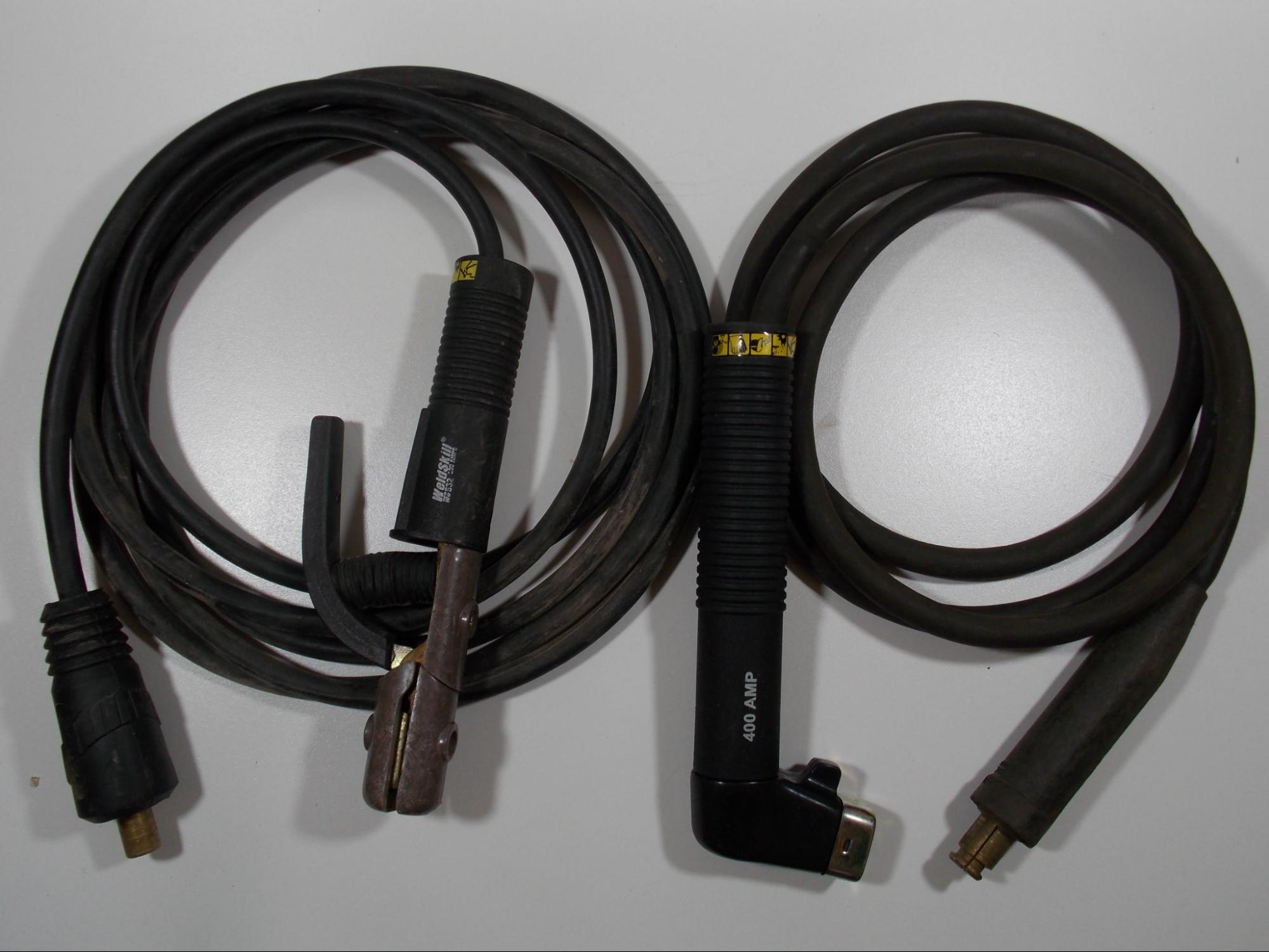 An example of an alligator clamp and a twist lock type electrode holder with leads and connectors.