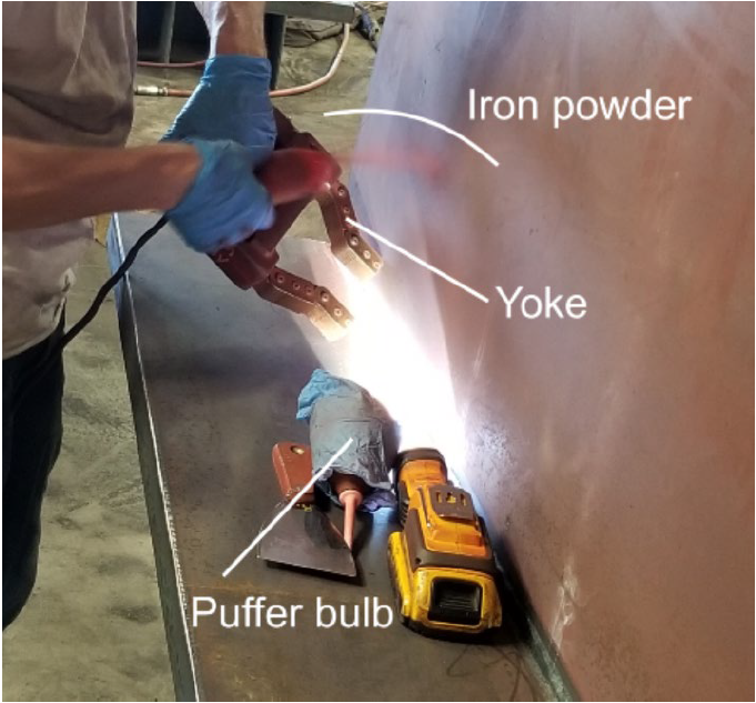 Magnetic Particle Testing of a very large weldment which is explained in the text preceding the image.