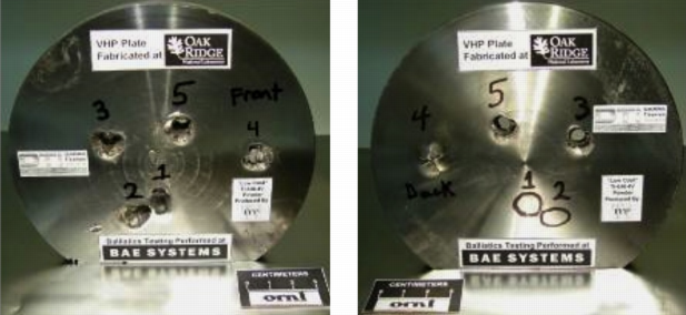 Two titanium ballistic test plates with puncture holes labeled with numbers.