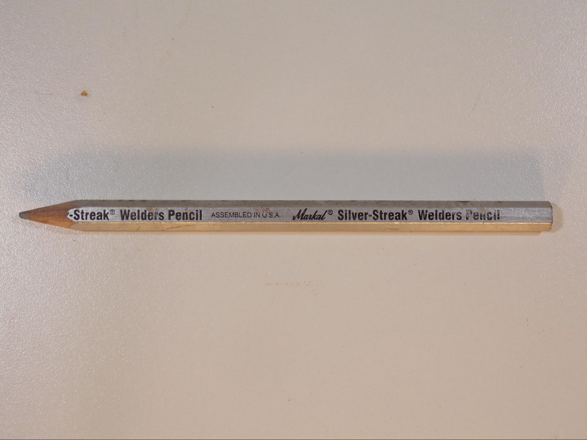 A pencil marked Silver-Streak Welder’s Pencil that uses a silver colored wax instead of pencil lead.