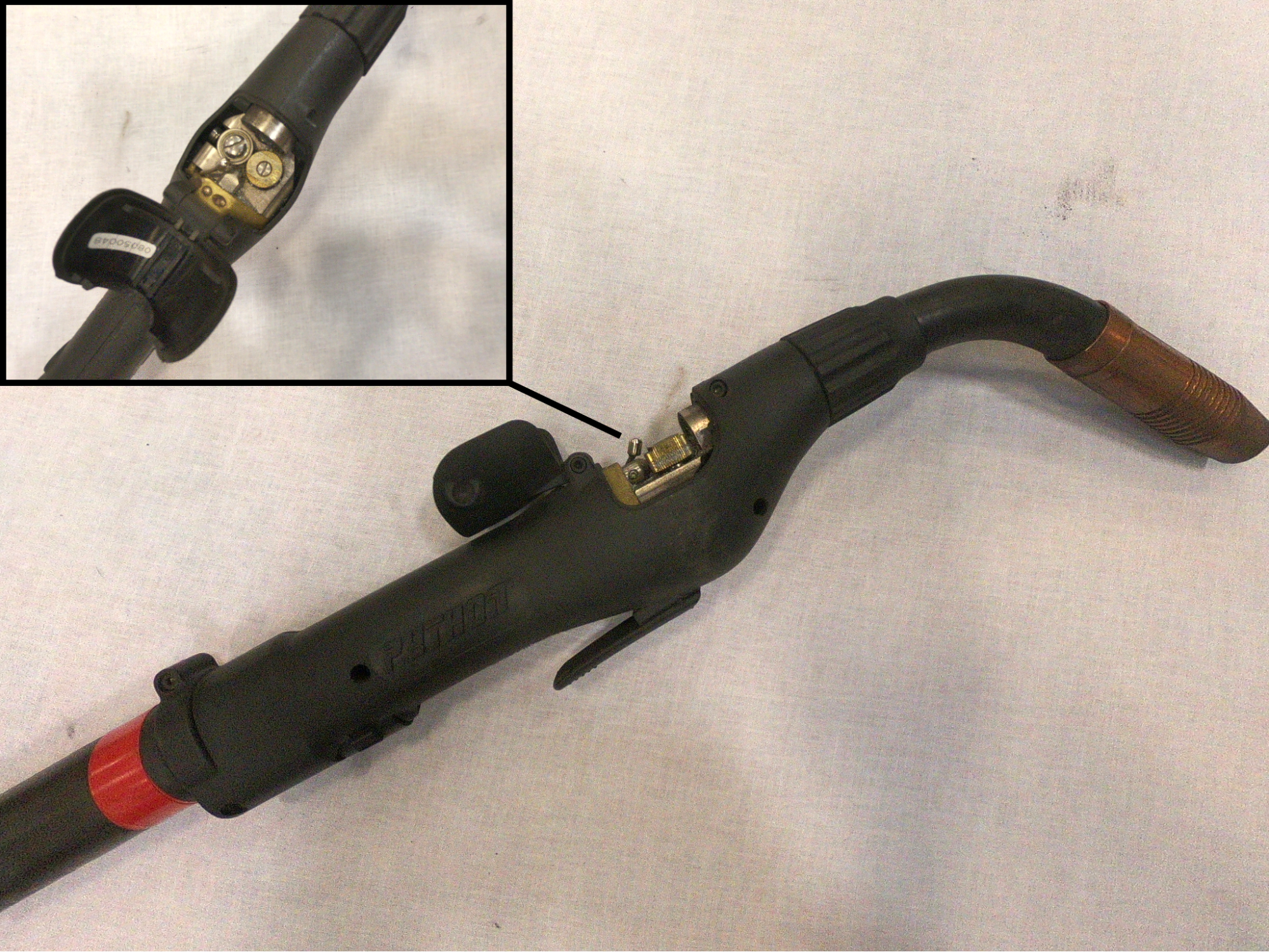 push-pull gun with a close-up of the drive rolls inside the gun handle