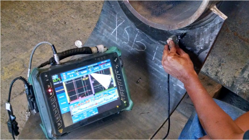 Phased Array Ultrasonic Testing in use by a technician, the PAUT screen shows a wider swathe of sound path.