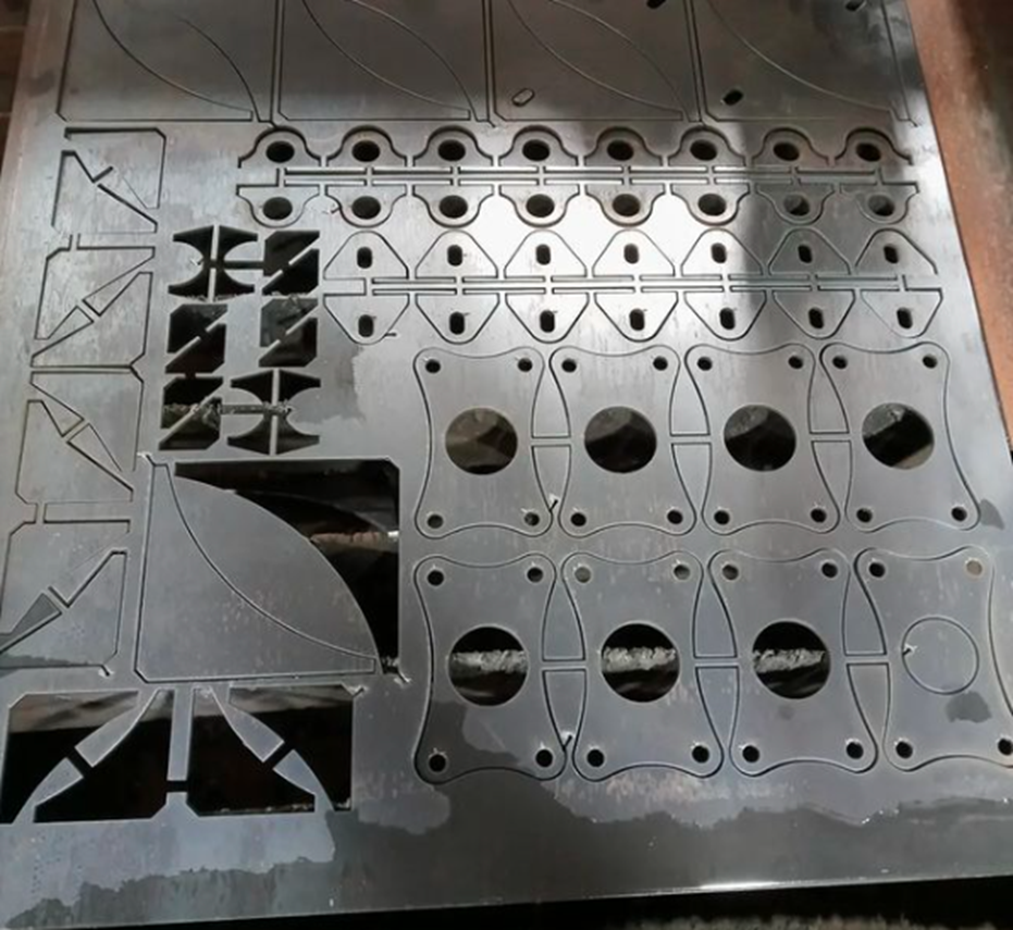 Parts cut on CNC plasma and nested to maximize material usage.