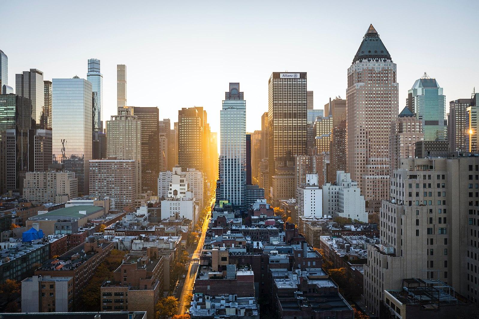 Skyscrapers in Manhattan with the sun setting behind them