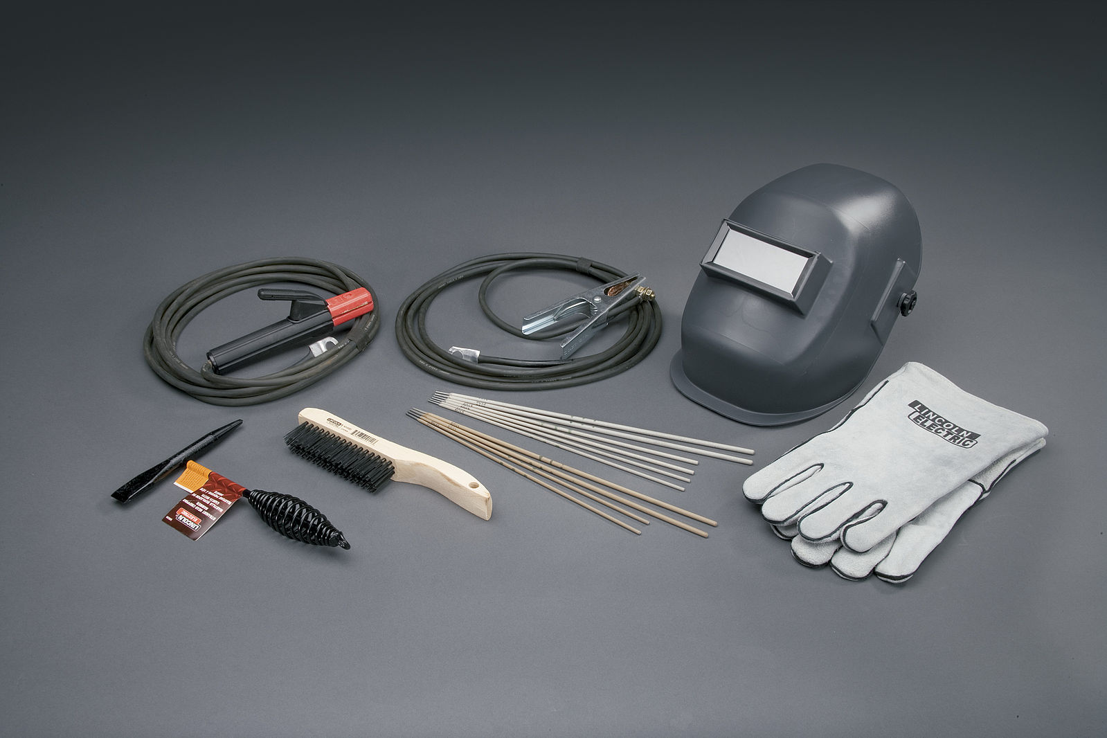 An assortment of tools and equipment for SMAW which are discussed in the text.