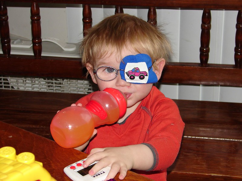 Child with eye patch