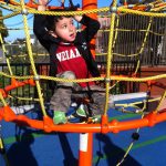 Child on flexible rope climber