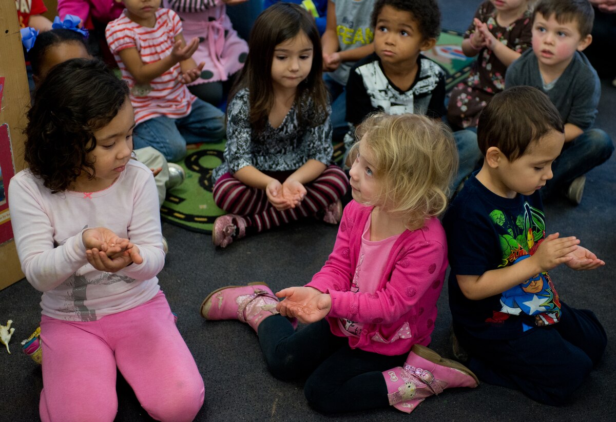 Children practicing handwashing skills.