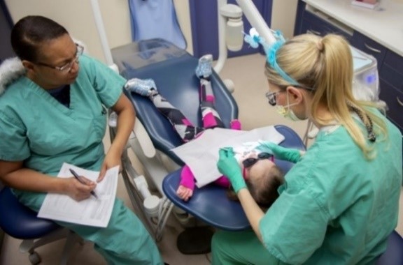 Child getting a dental exam