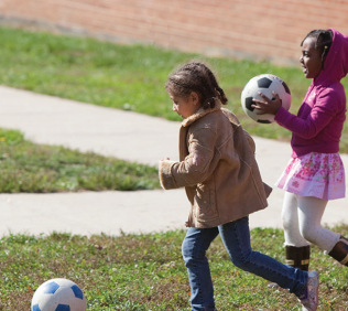 Children playing soccer