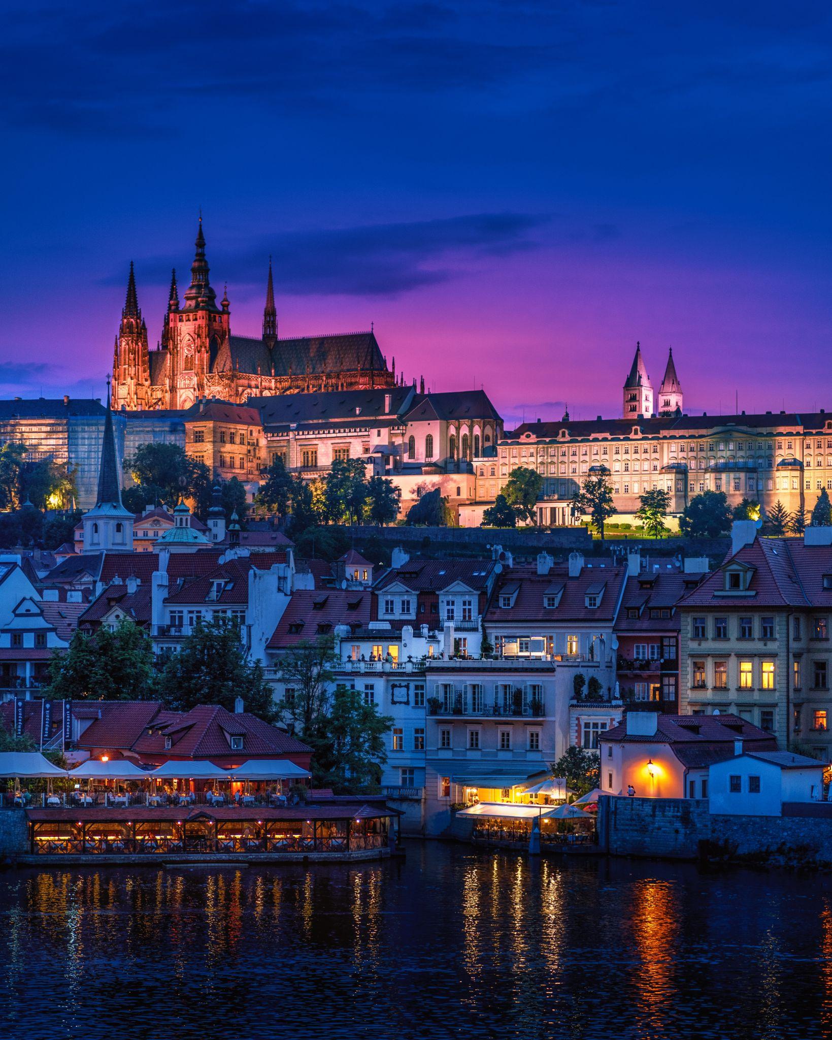 Night time view of a town with a view of St. Vitus Cathedral in Prague