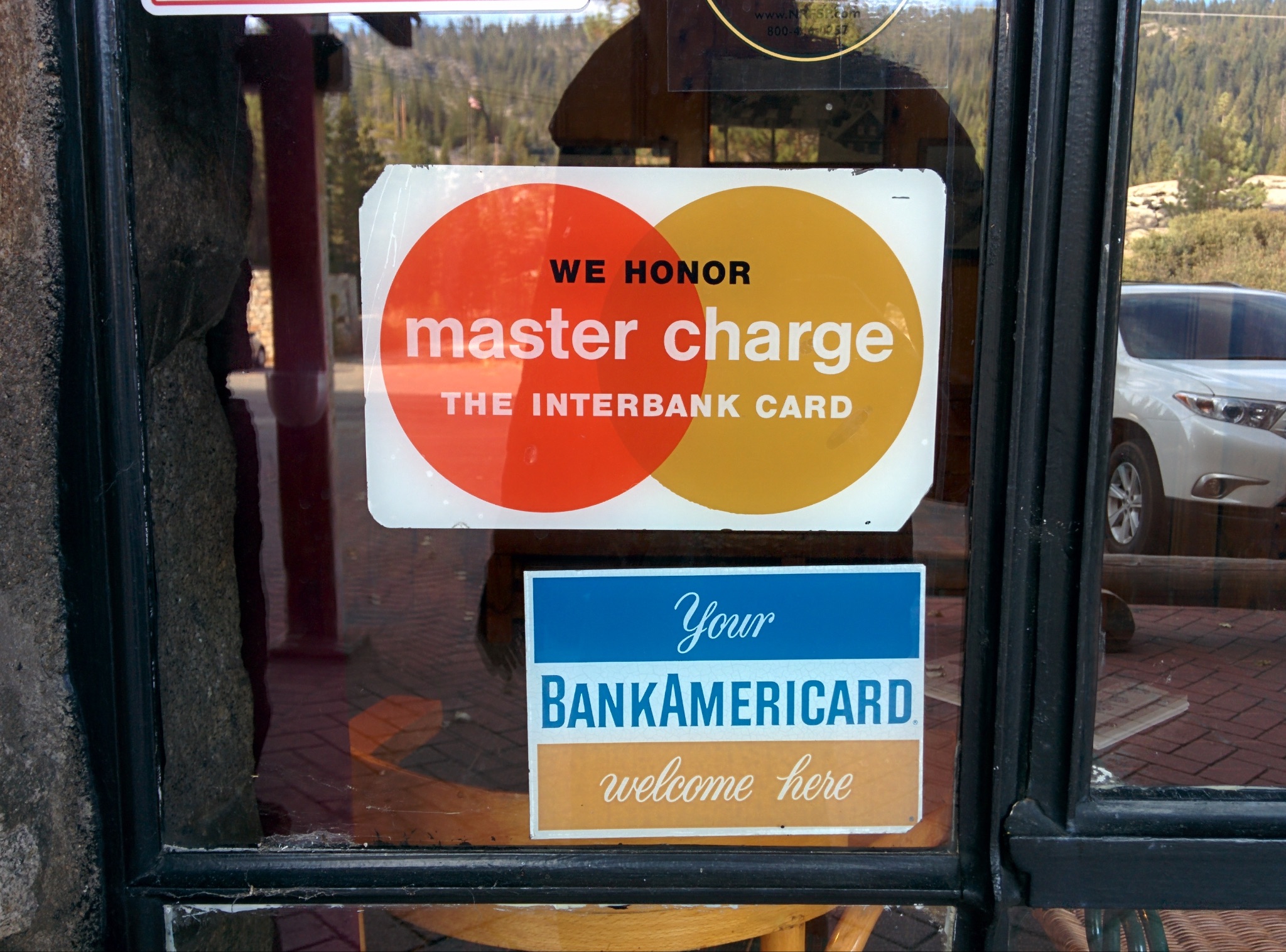 Credit card information posted for customers outside a restaurant.