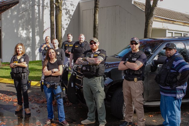 Photograph of a group of Community Corrections Officers equipped for duty.