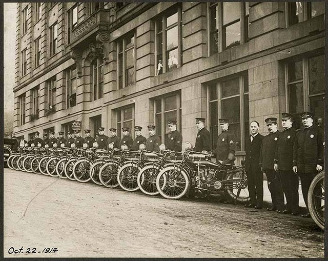 This photograph showcases the Seattle Police Department’s 15-officer motorcycle squad proudly displaying their new Indian brand motorcycles.