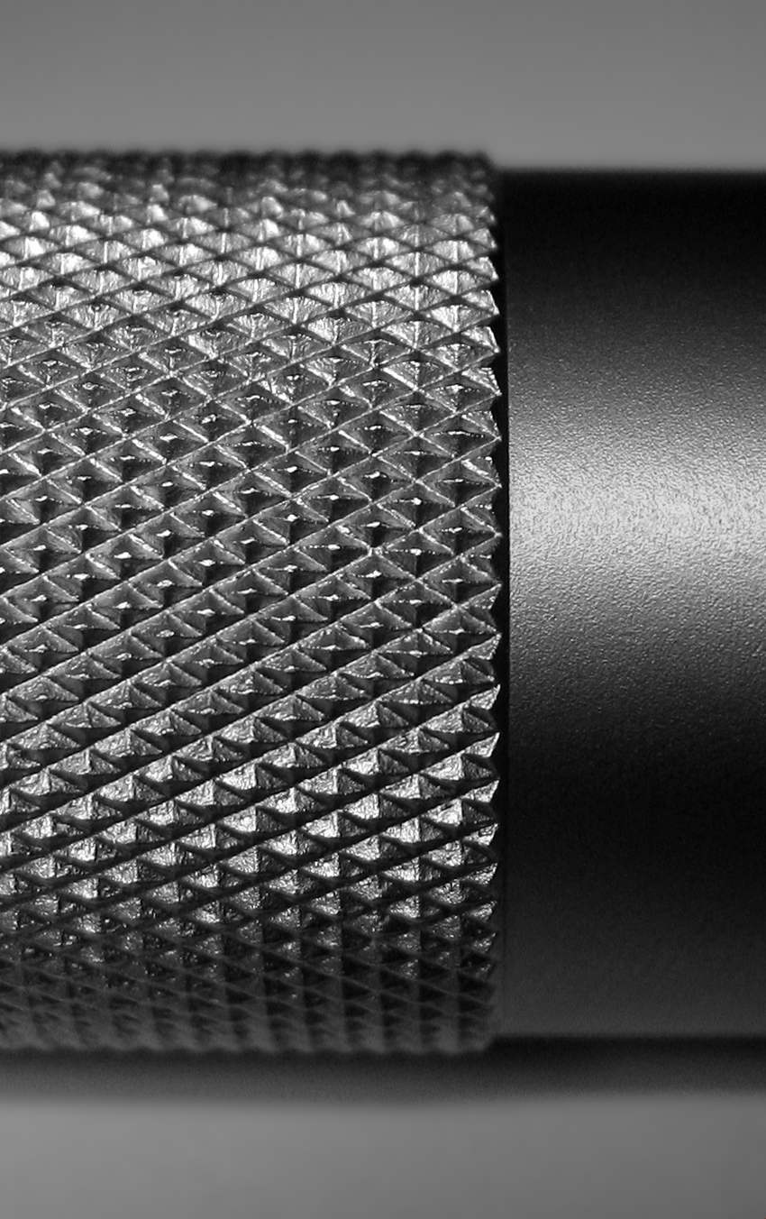 Close up view of a part that has been knurled.