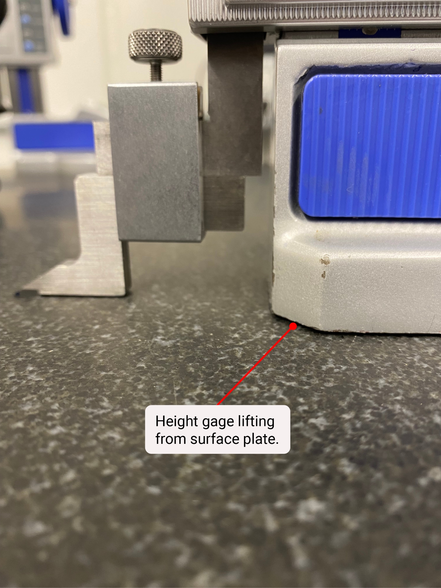 An arrow points to a gap under a height gage.