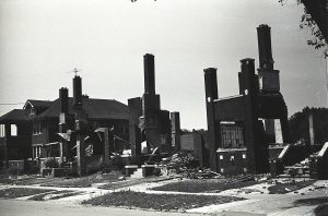 Photograph of a building reduced to its brick foundations, destroyed by fires during the 1967 Detroit Riot.