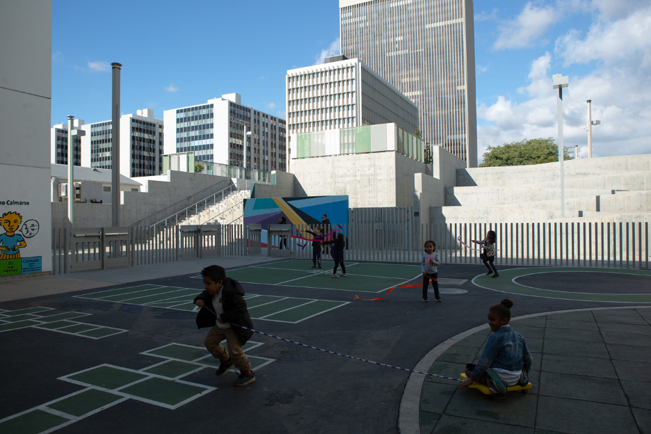 Elementary students spread out while playing on the playground