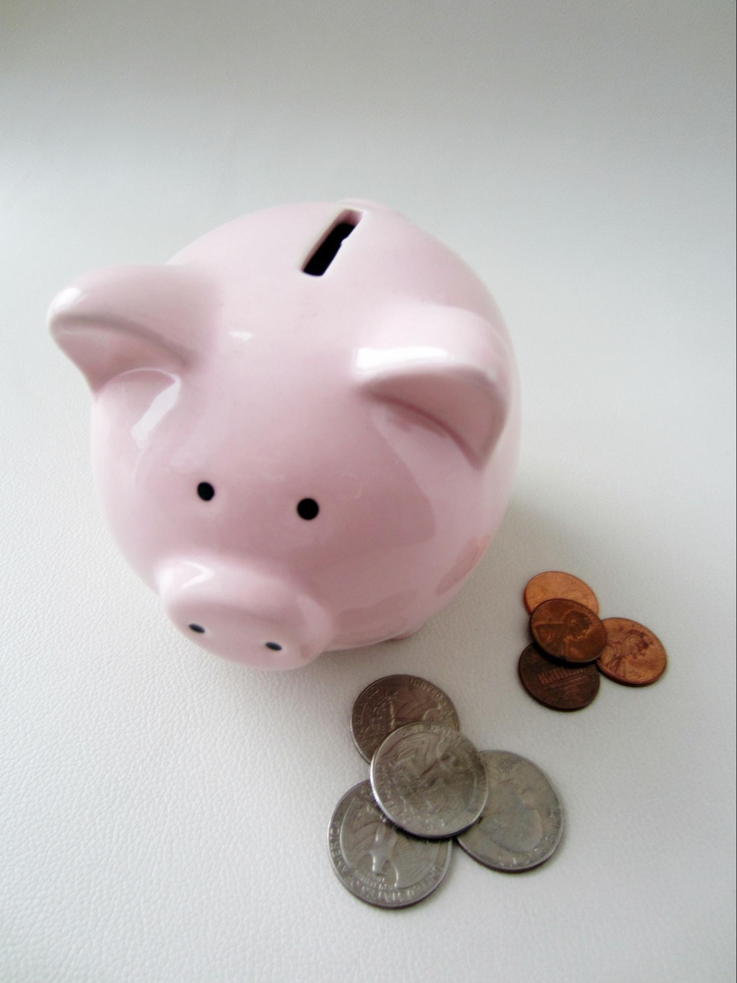 Piggy bank and a stack of coins.