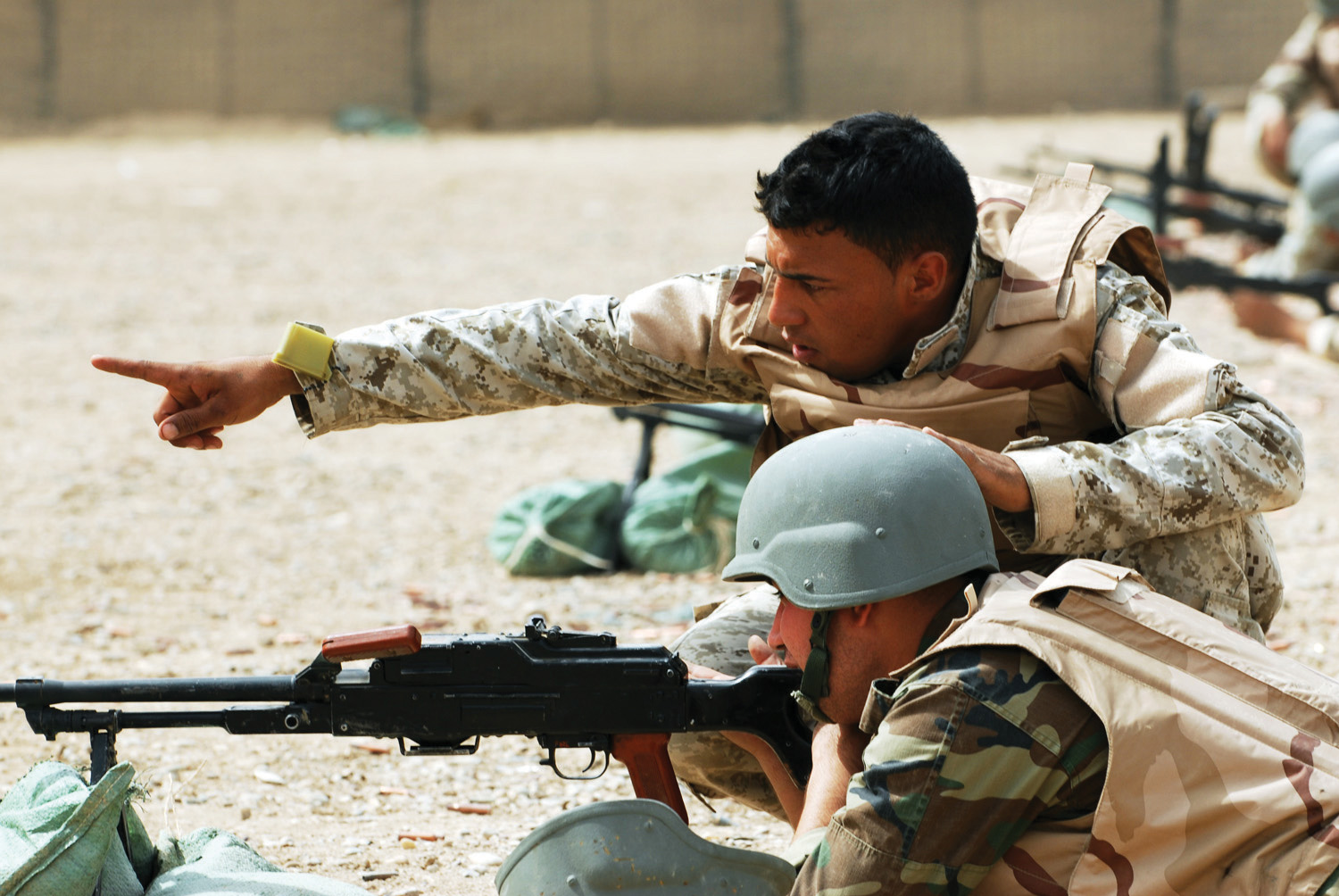 Men in the army working on target practice