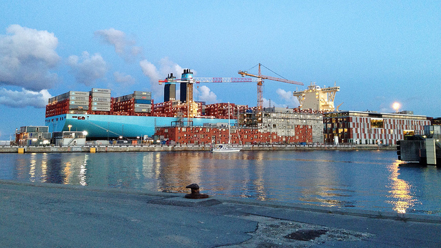 A giant cargo ship being loaded with crates in Denmark