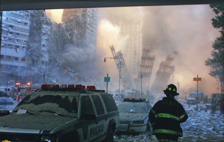 A firefighter standing in the remnants of the twin towers