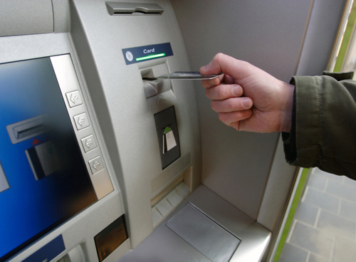 A man using an ATM