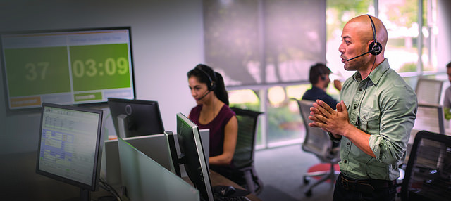 A call center with employees taking surveys over the phone