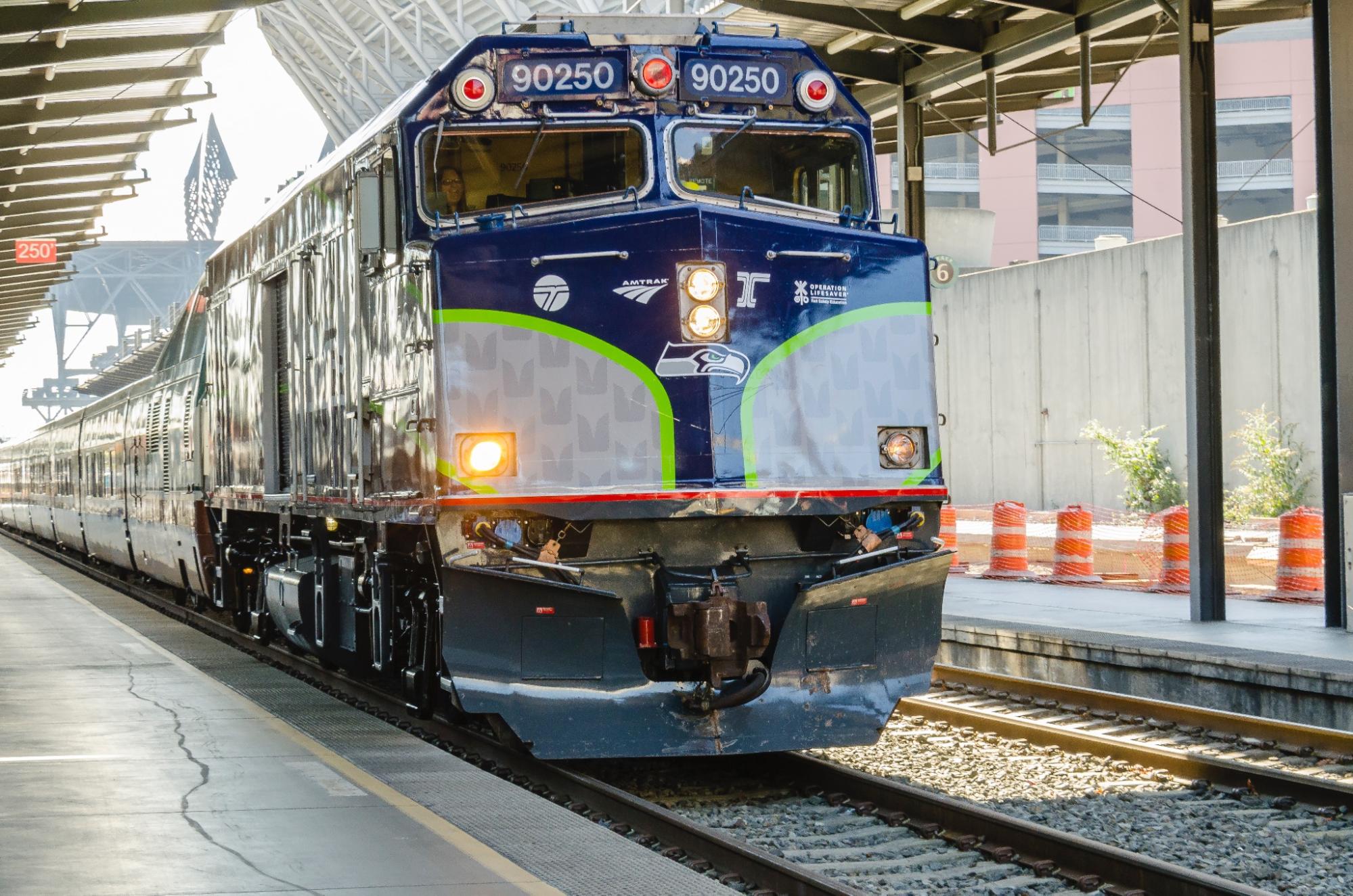 A Seattle Seahawks themed train heads south from Seattle.