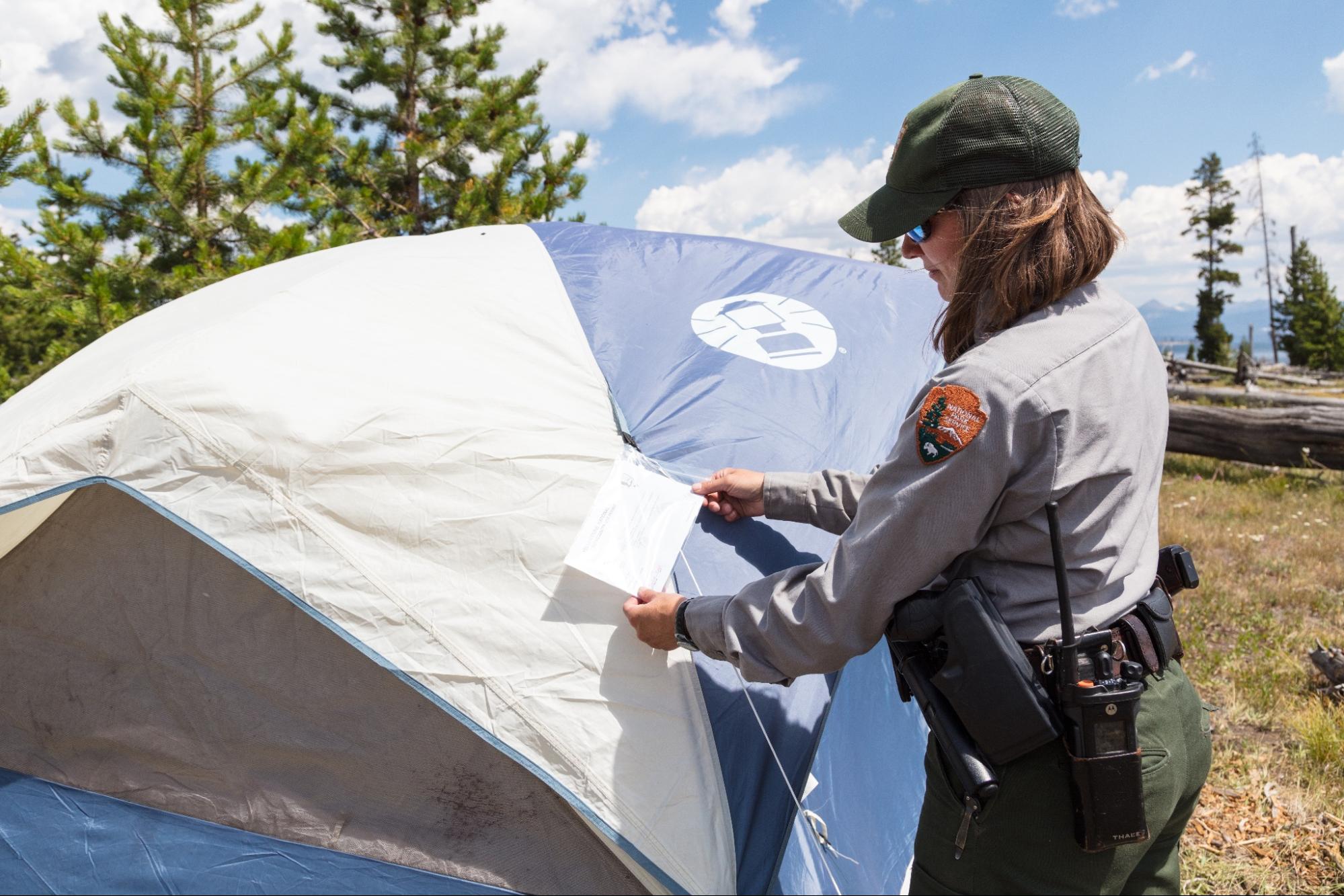 A ranger checks the validity of a backcountry permit.