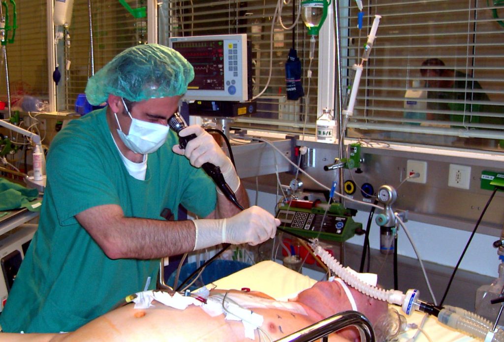 Photo showing a doctor performing a bronchoscopy procedure