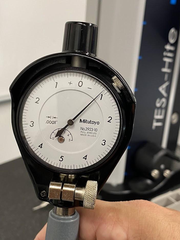 A bore gage with the indicator needle reading .009”.