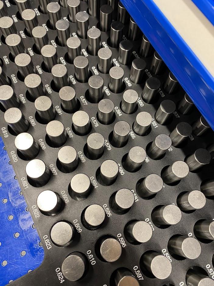 A set of inspection pins in a plastic case.