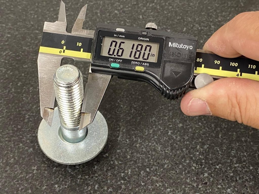 A slide micrometer is used by pressing on the thumb wheel.