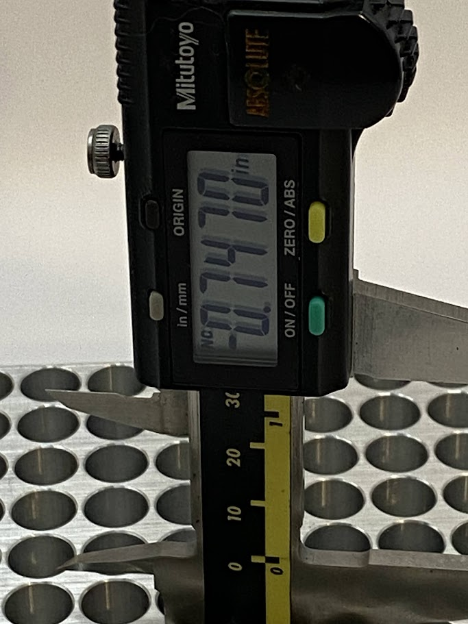 The reading on the display is the depth of the hole from the top surface to the shelf that the pin is resting against. The display on the caliper reads .747”.