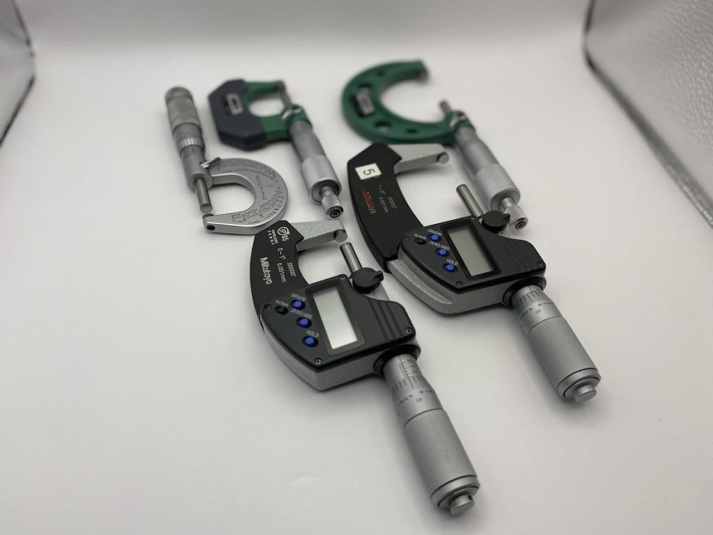 Five different types of outside micrometers in both digital and vernier.