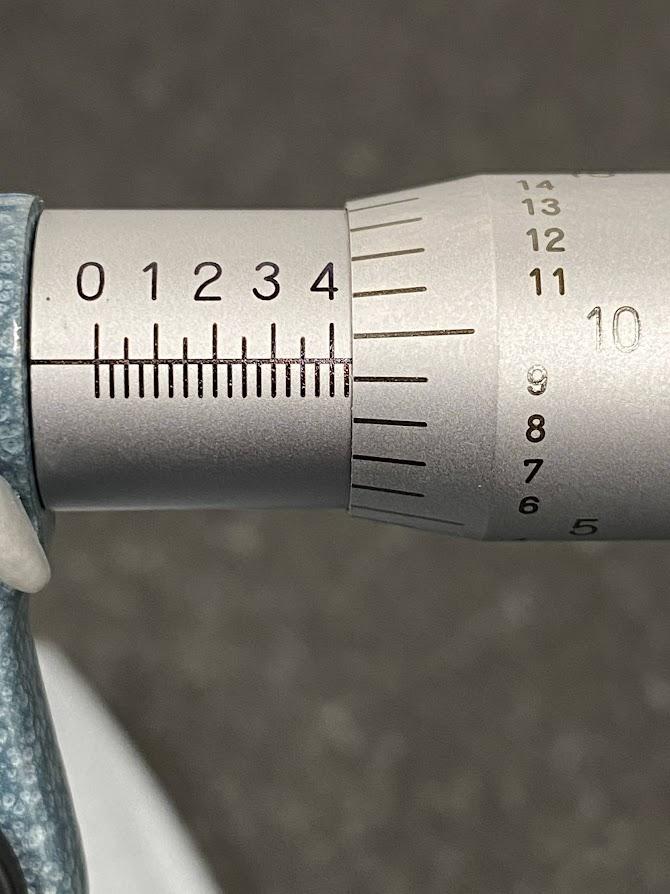 The scale is viewed as the thimble is turned.